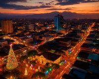 Davao City skyline at night with festive holiday lights.